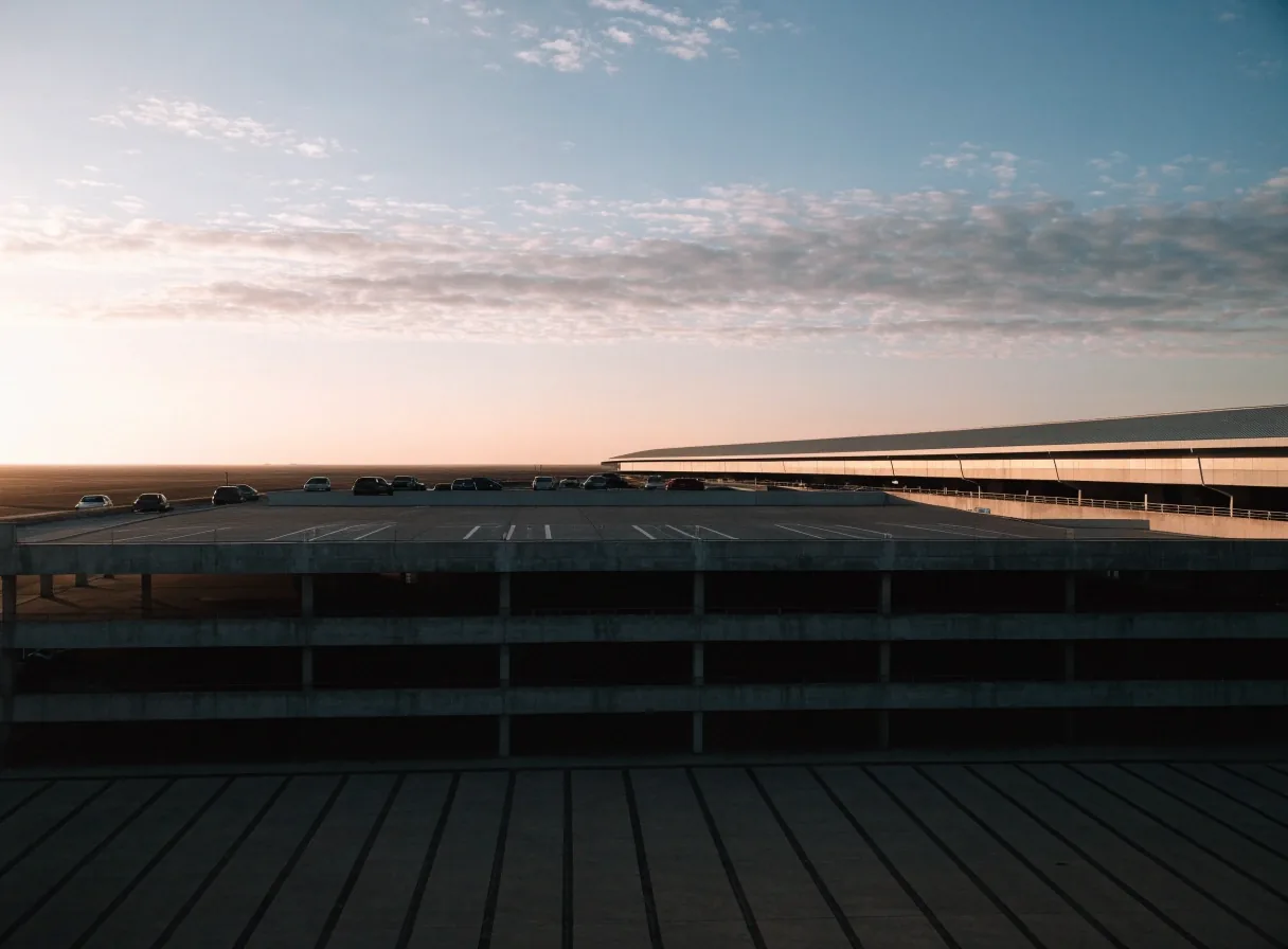 Multi-storey car park building at Melbourne Airport seen at first light from the airside forecourt